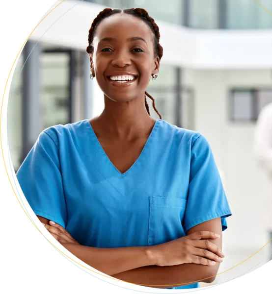 a female doctor smiling with her arms crossed